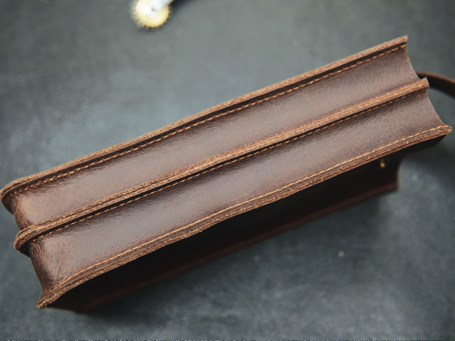 “Dual-compartment leather phone pouch for two smartphones – top view”