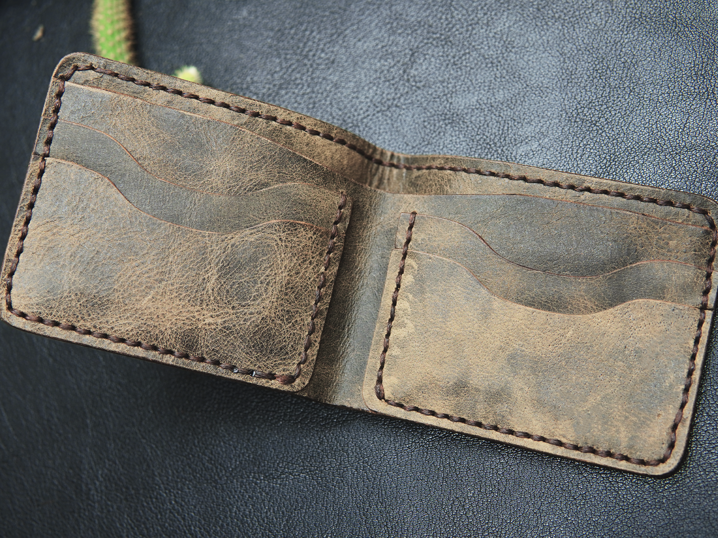 hand-stitched leather wallet with 4 card slots and 1 cash compartment