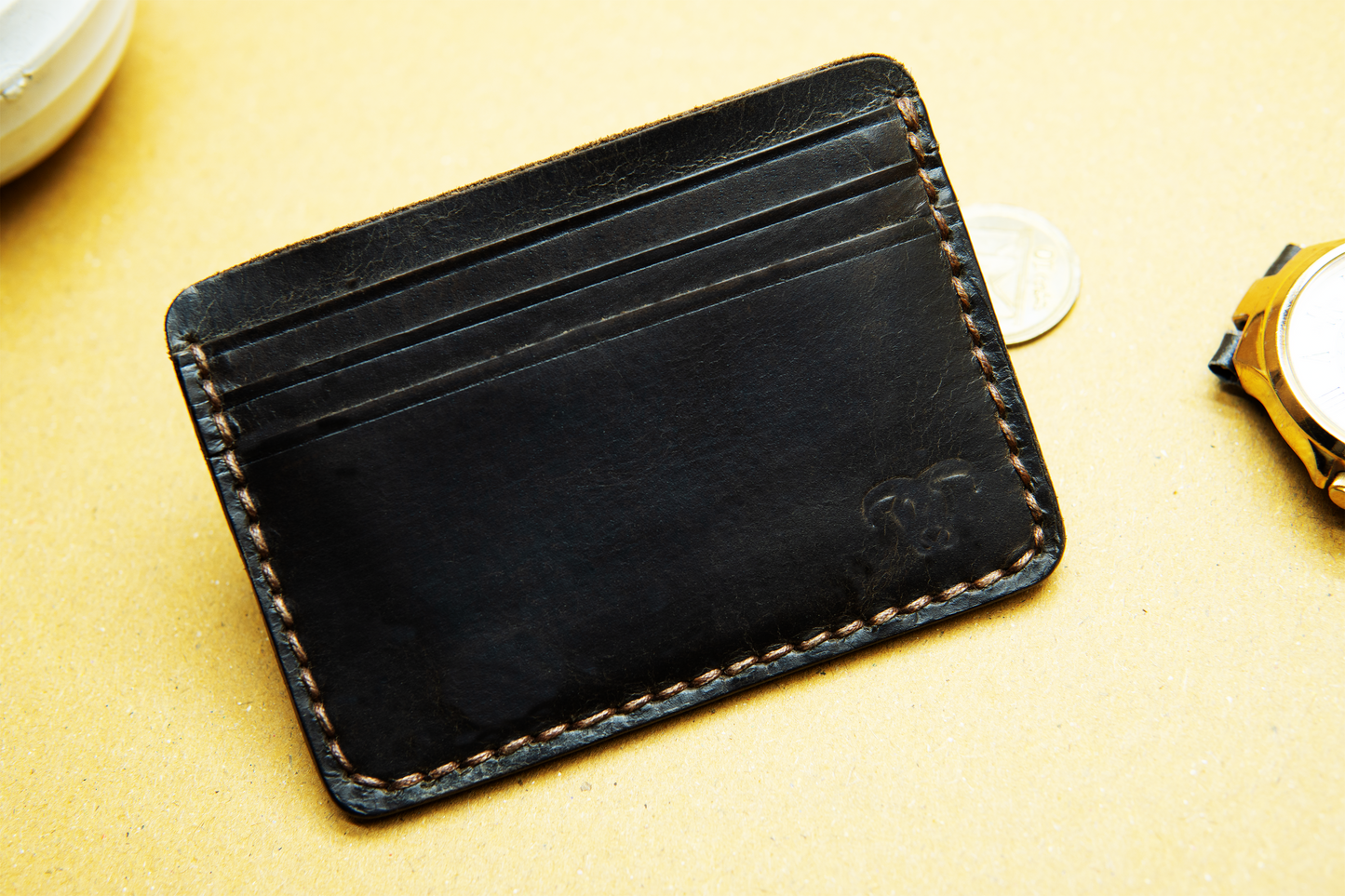 Premium brown leather card holder with 6 card slots.