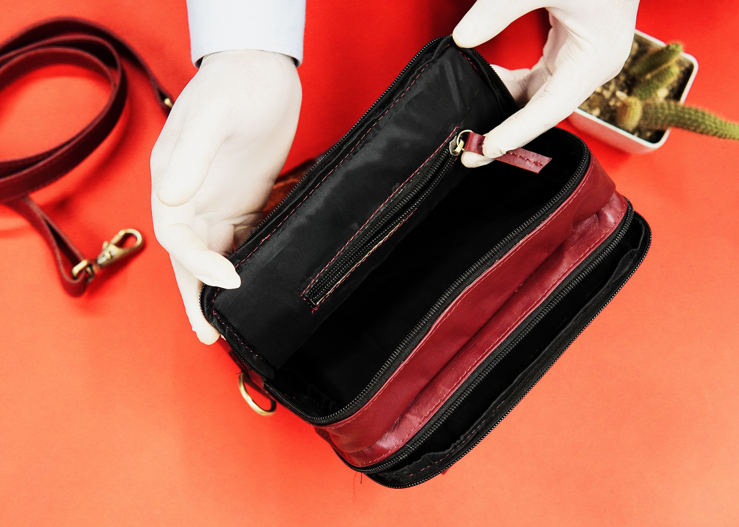 Sleek leather cross bag with multiple compartments for organized storage.