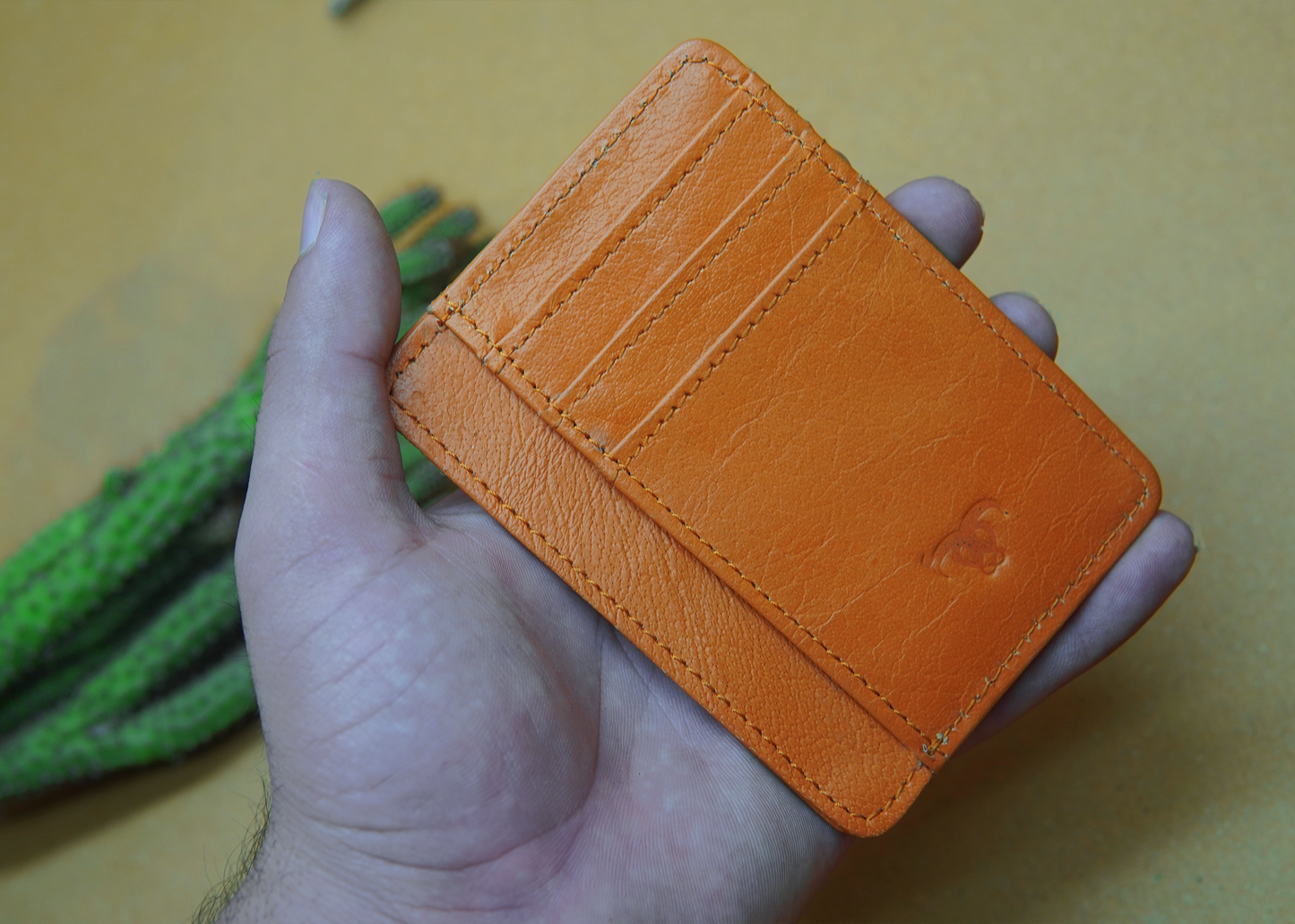 Stylish orange leather card holder with 7 slots – perfect for organizing your essentials