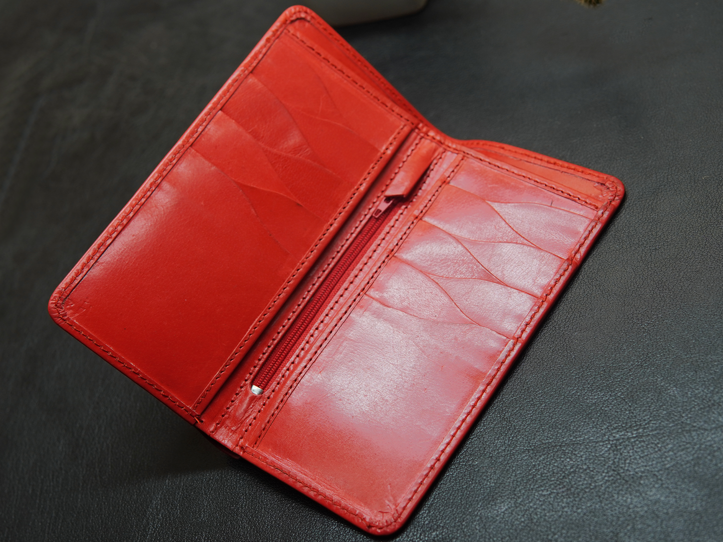Red bifold leather wallet