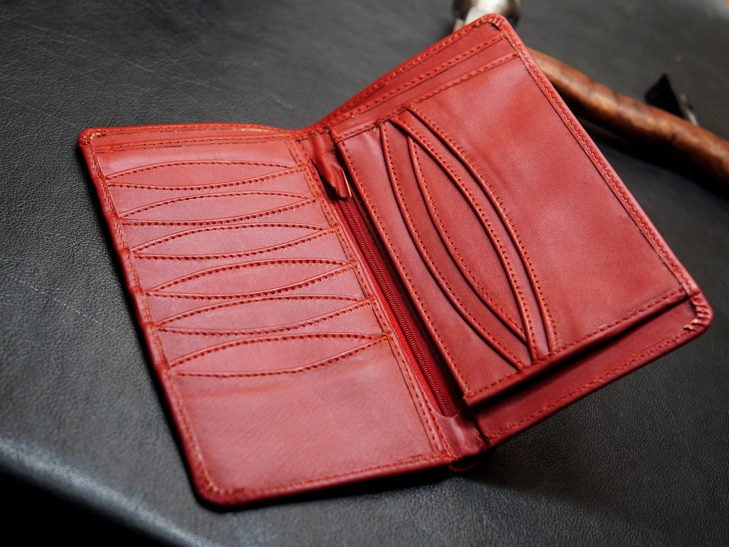 Red leather wallet with multiple caed and reciepts slot