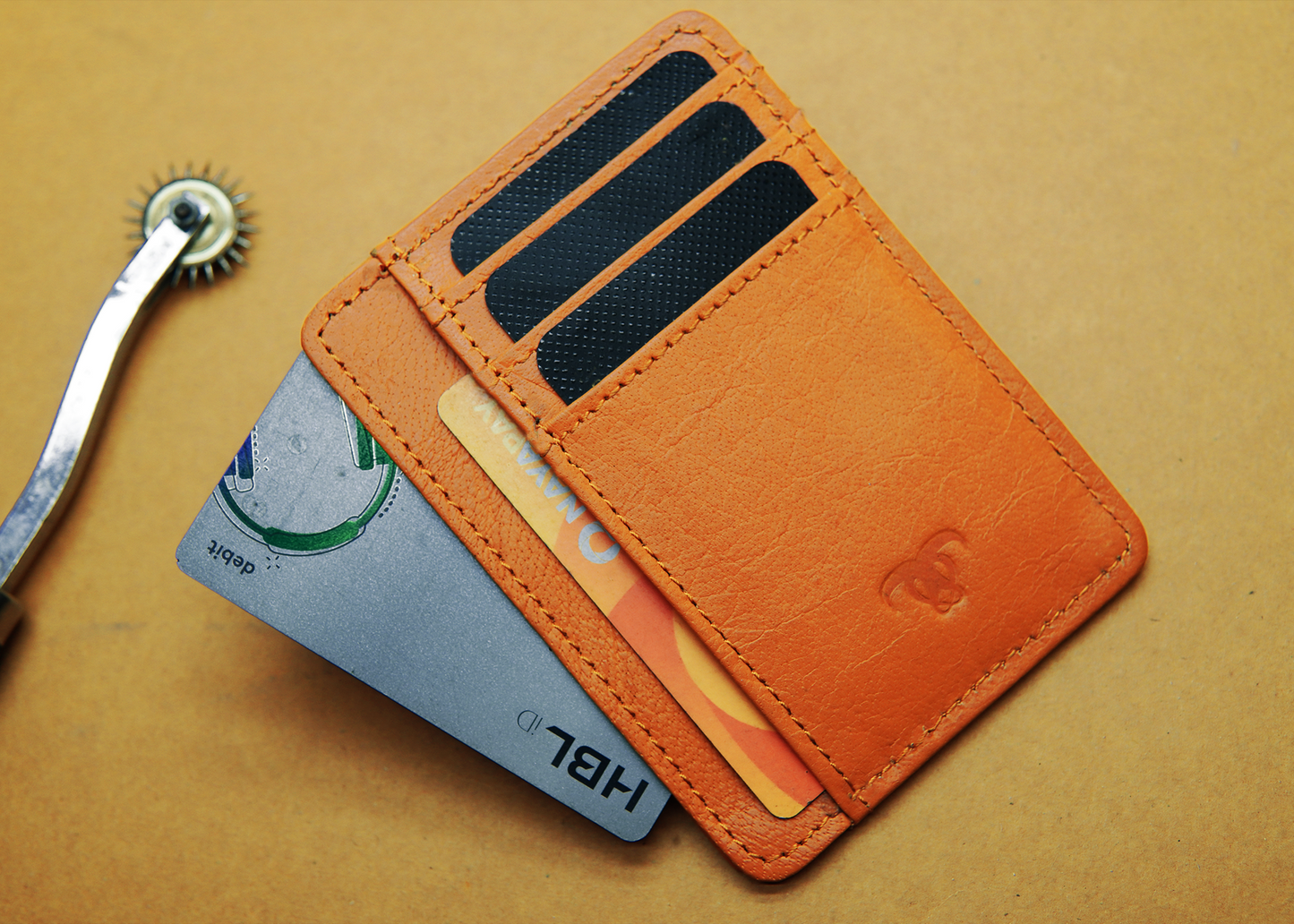 "Premium orange leather card holder with 7 card slots – stylish and compact wallet for men in Pakistan."