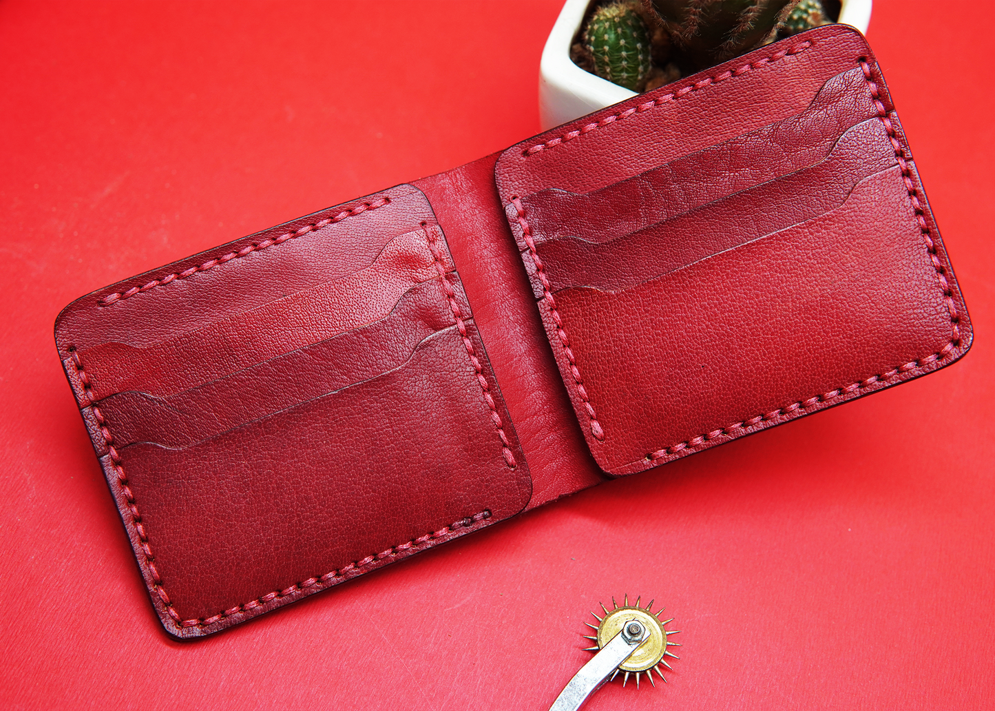 Scarlet red leather wallet featuring a spacious yet minimalist design.