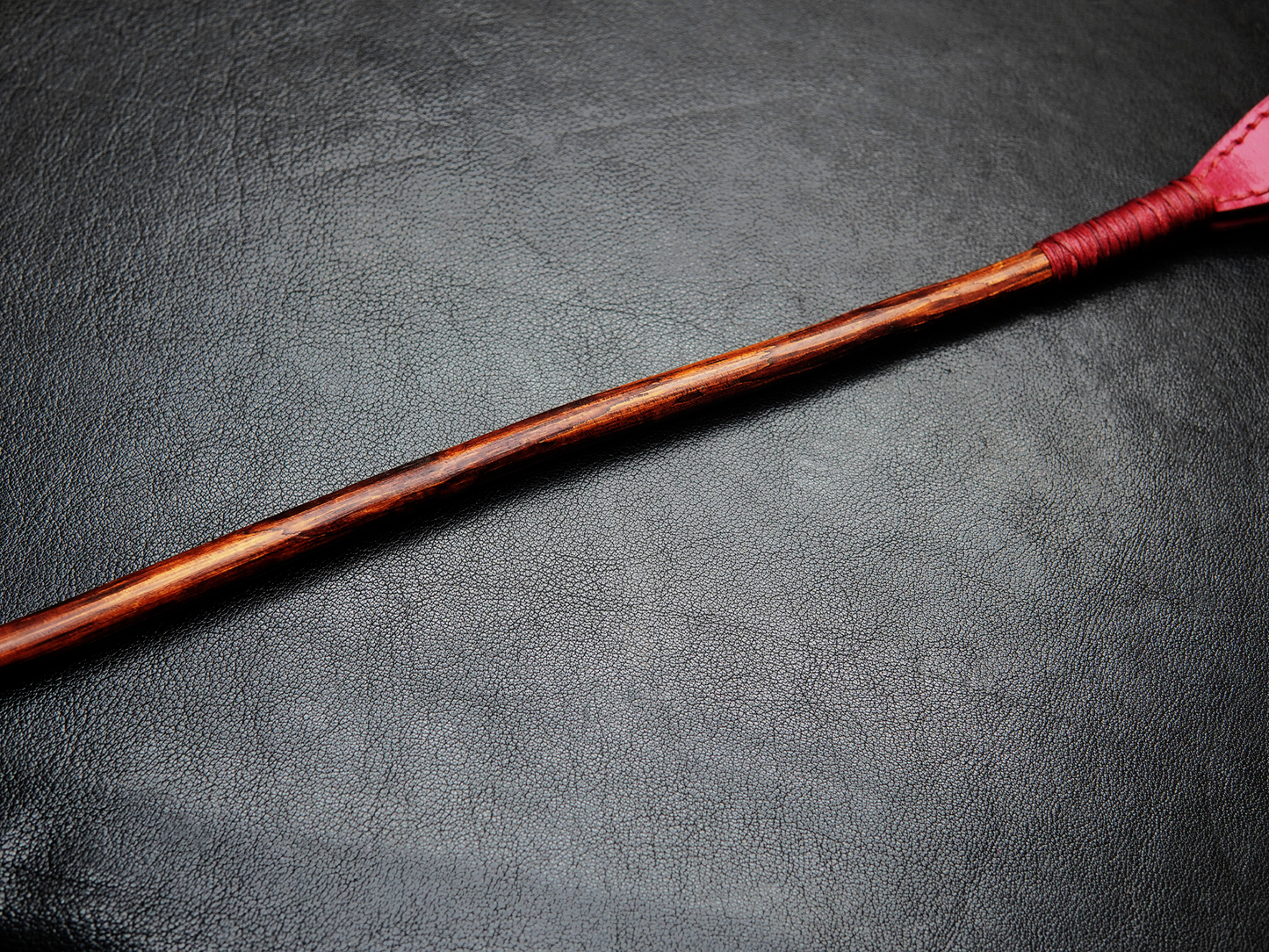 Close-up of Bovidas Whip wooden handle