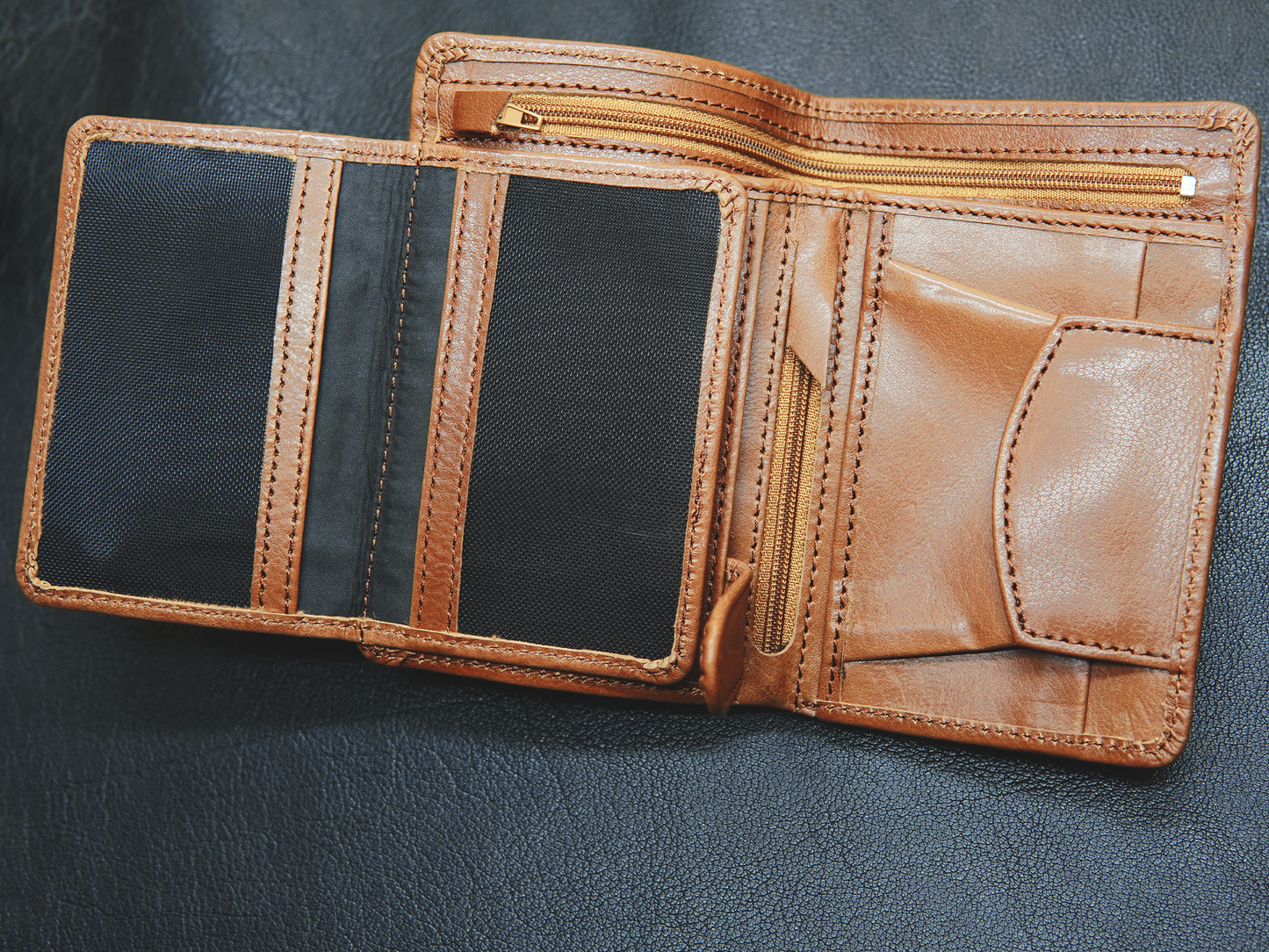 "BOVIDAS CoreFold wallet open view – showing 2 ID comaprtment, 1 small zip for valuable, 1 zipper full lenght cash compartment and button slot