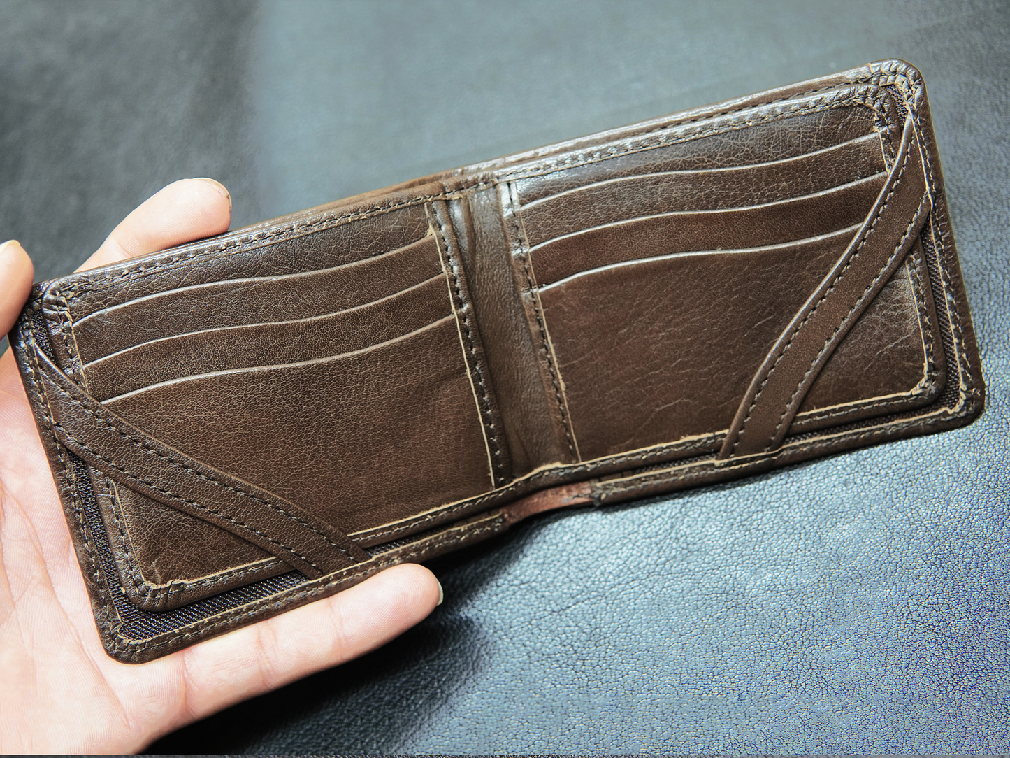Detailed view of vertical card slots for organized storage in FoldClassic wallet