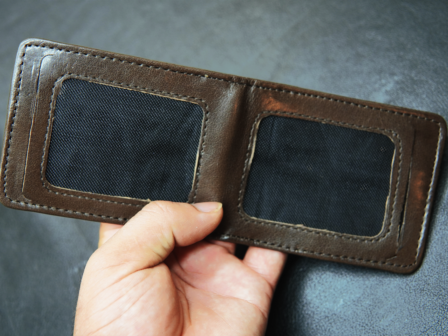 Close-up of hidden ID card slot inside BOVIDAS FoldClassic wallet for private storage