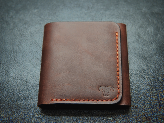 full-grain leather texture and hand stitched
