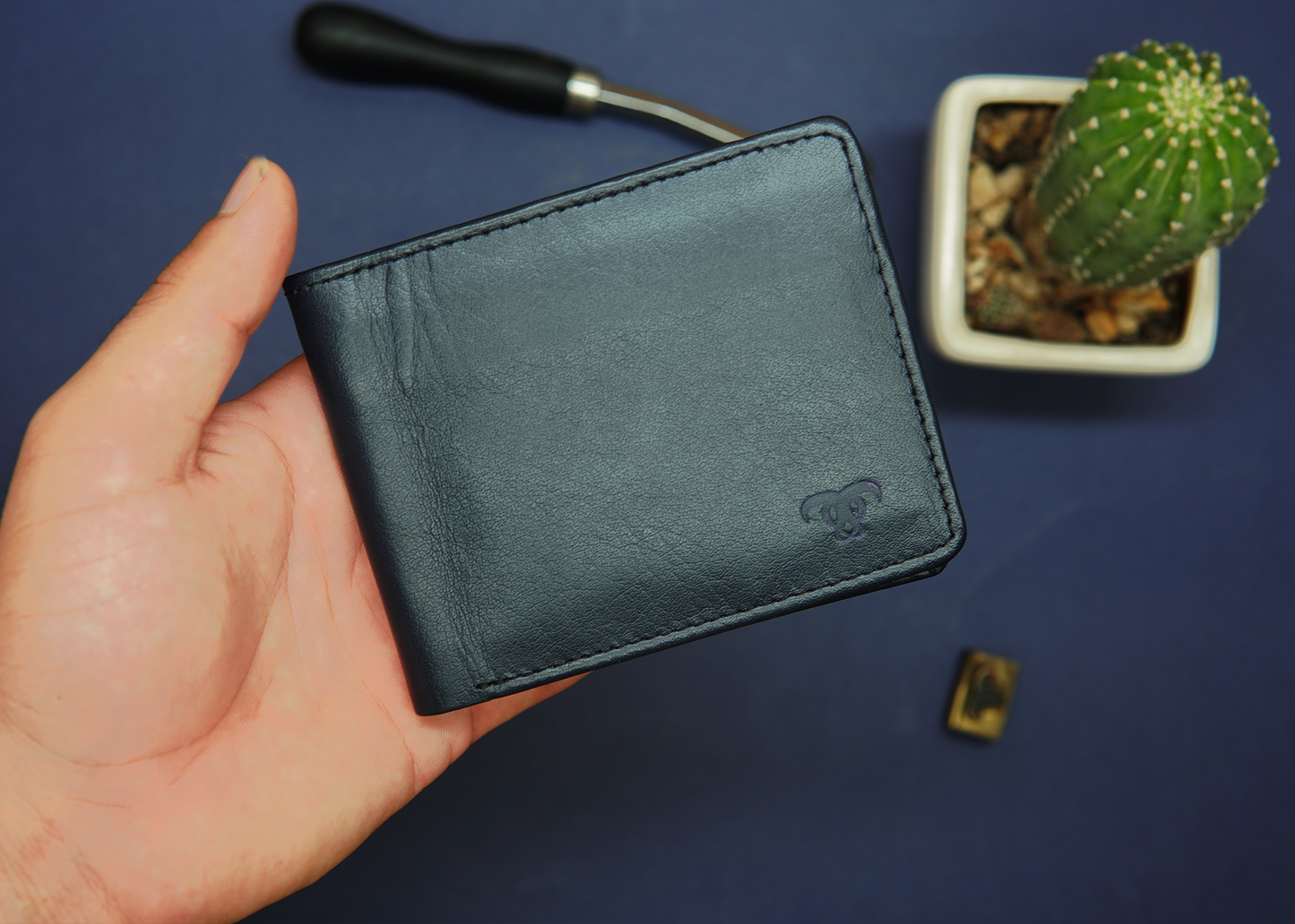 Premium blue leather wallet with fine stitching and a smooth finish.