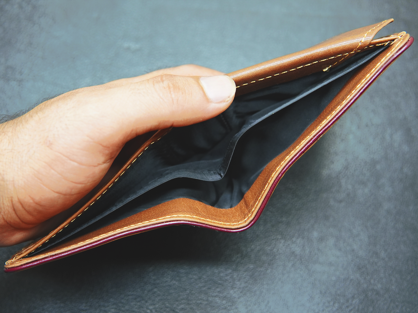 Two separate cash compartments inside Velario Classic wallet for organized storage