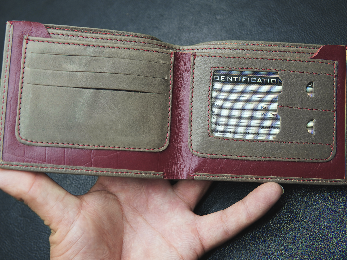 Brown leather wallet with 4 card slots, photo slot, and 2 cash compartments