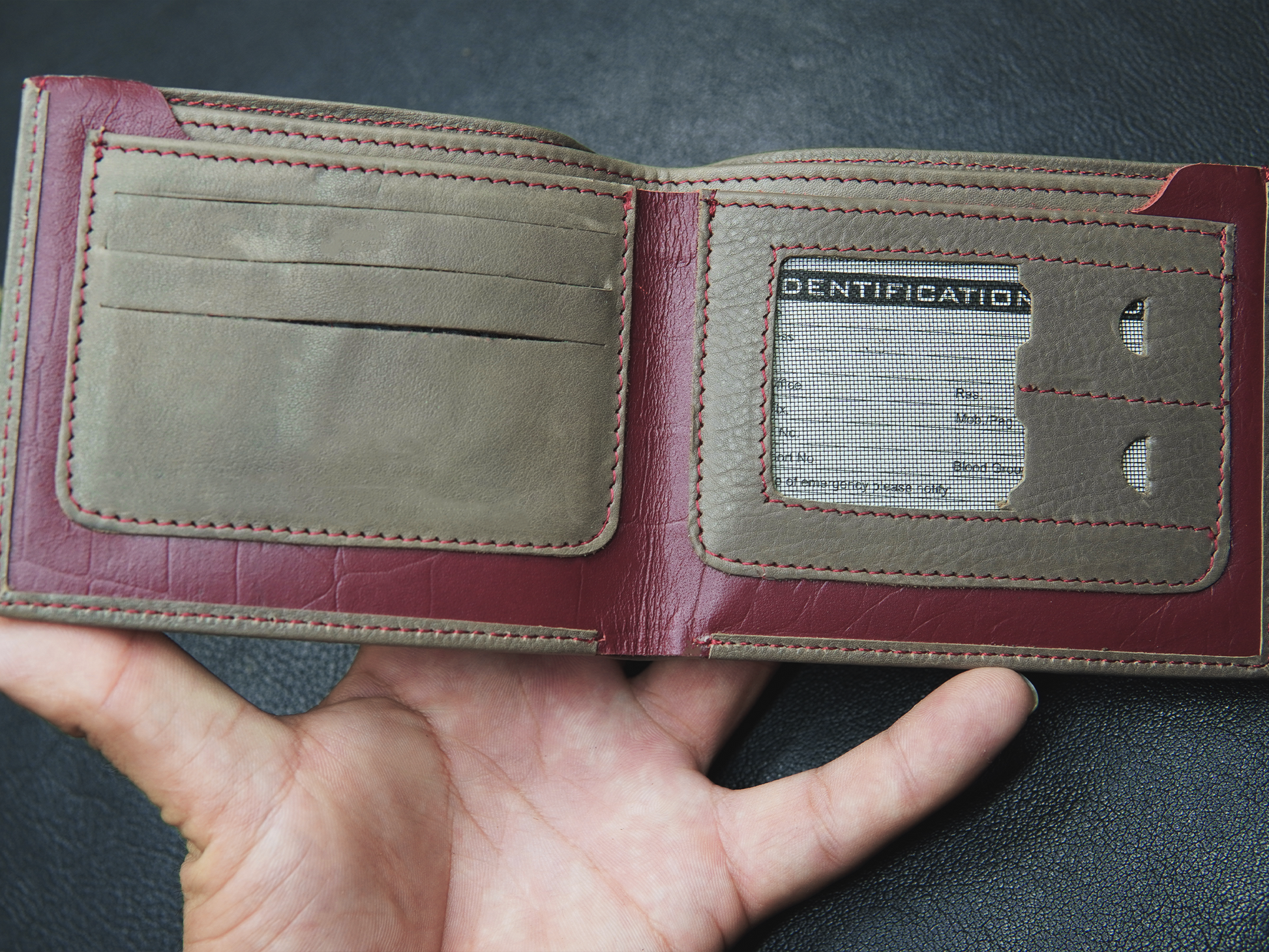 Brown leather wallet with 4 card slots, photo slot, and 2 cash compartments