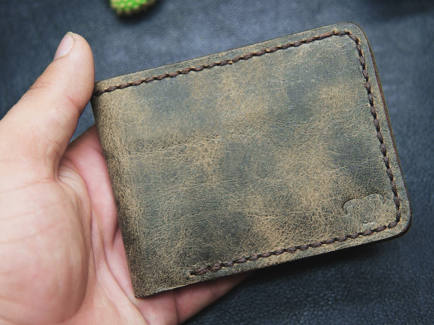 hand-stitched leather wallet with 4 card slots and 1 cash compartment

