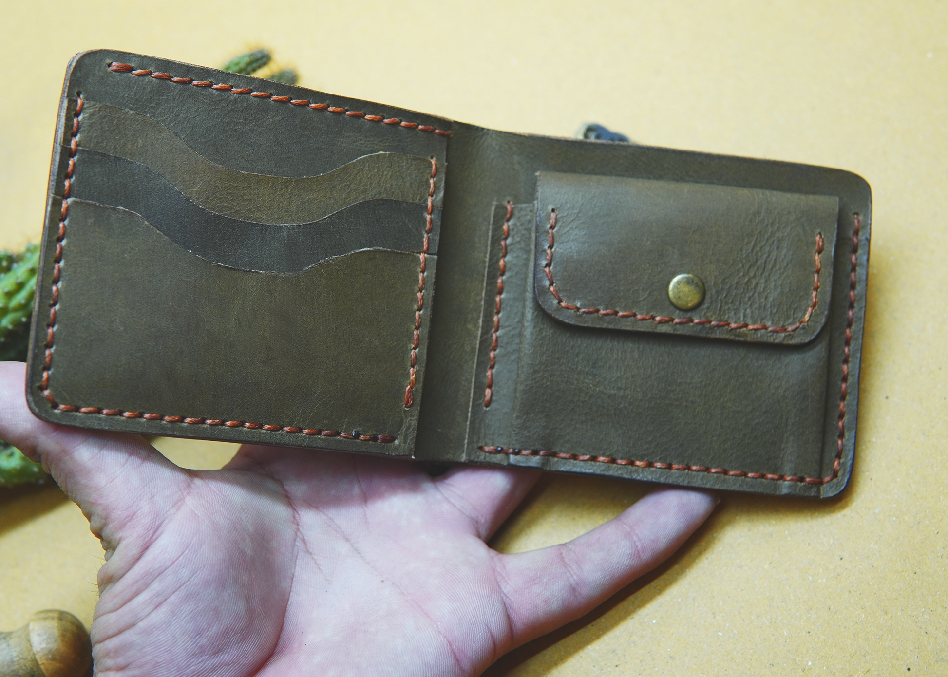 High-quality orange leather wallet featuring a secure coin pocket

