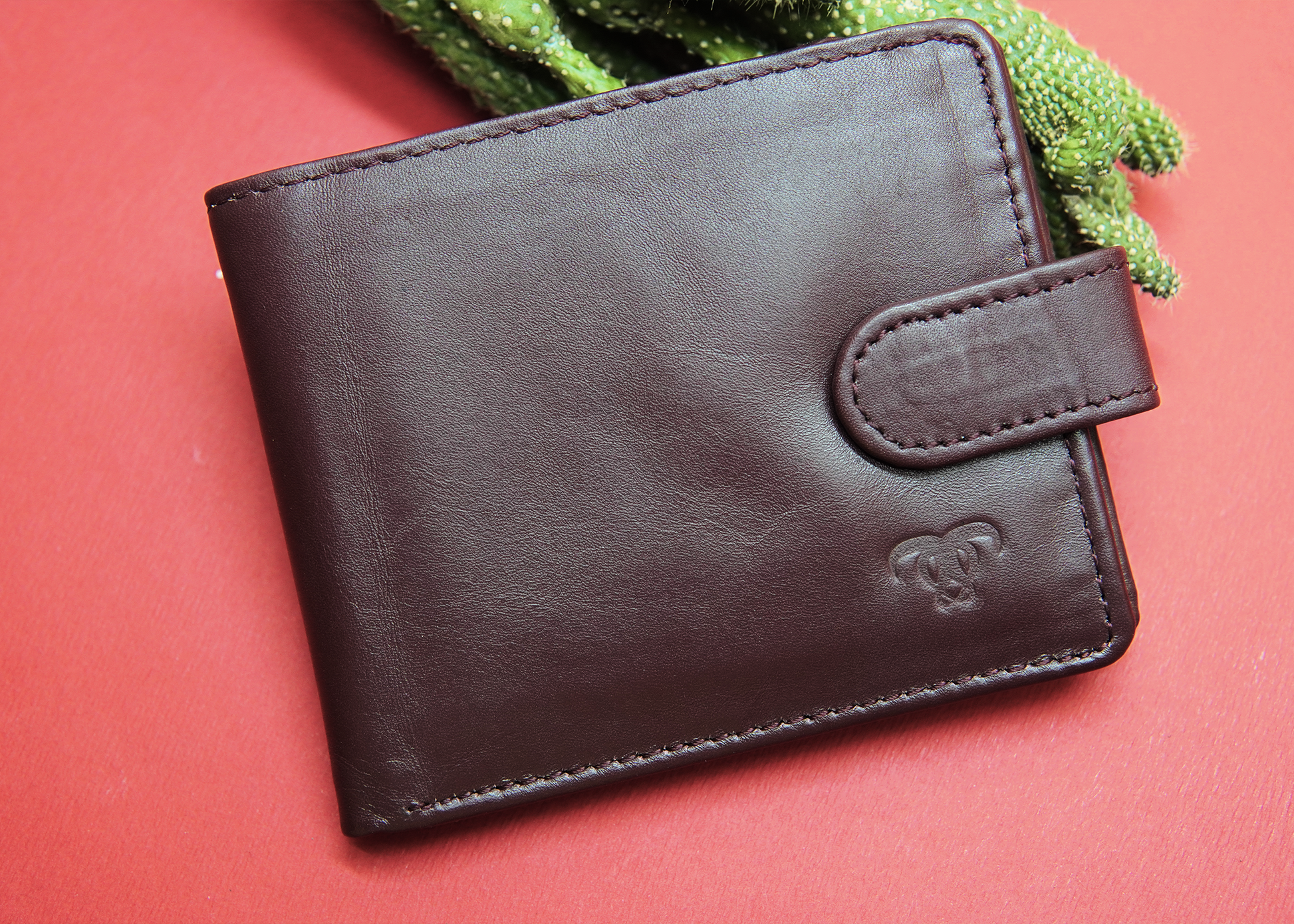 Premium chocolate leather wallet with a fine texture and smooth finish.