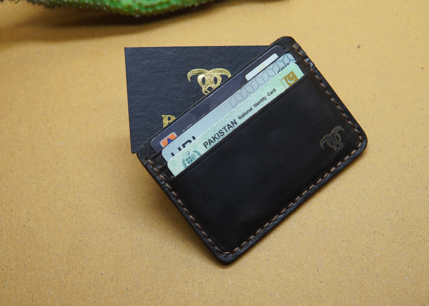 Premium brown leather card holder with 6 card slots.

