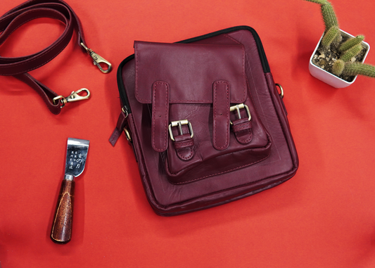 Leather cross bag featuring a secure back zipper pocket.