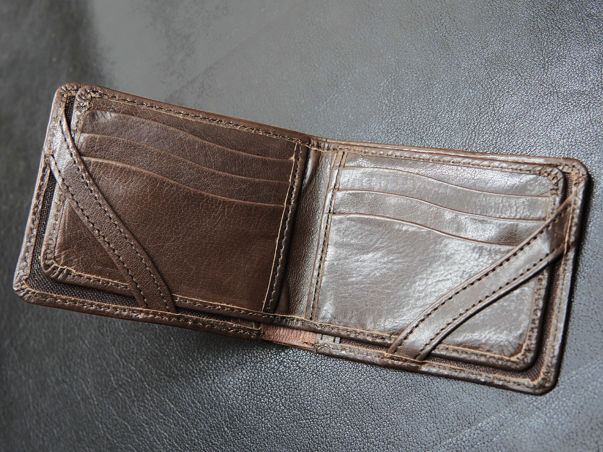 Open view of FoldClassic wallet showing 8 vertical card slots 