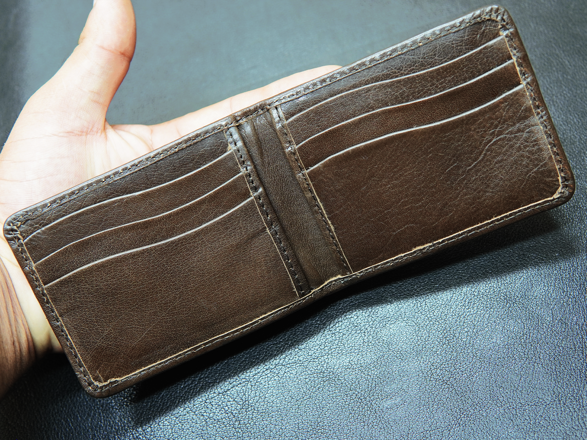 Interior view of FoldClassic wallet showing 4+4 card slots.