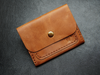  handmade brown leather card holder with snap closure – crafted from full-grain leather.