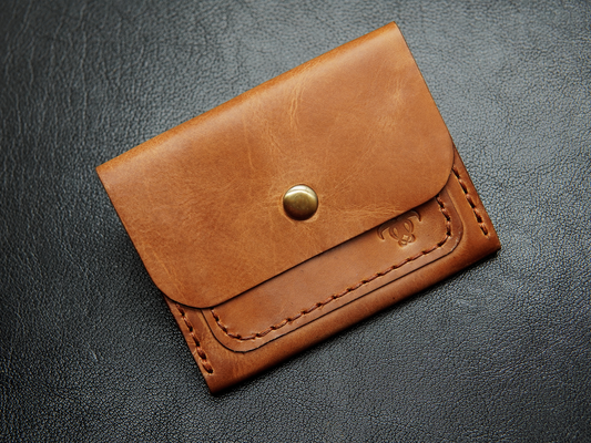  handmade brown leather card holder with snap closure – crafted from full-grain leather.