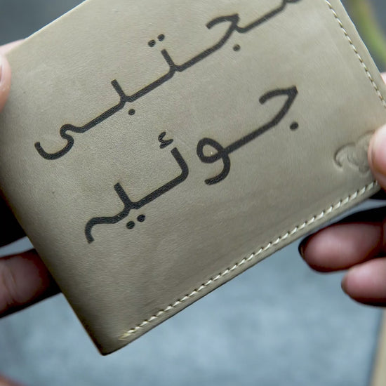 video showing the detail view of beige customize leather wallet