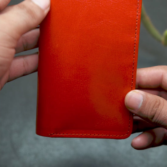 Video showing the detail view of long red leather wallet