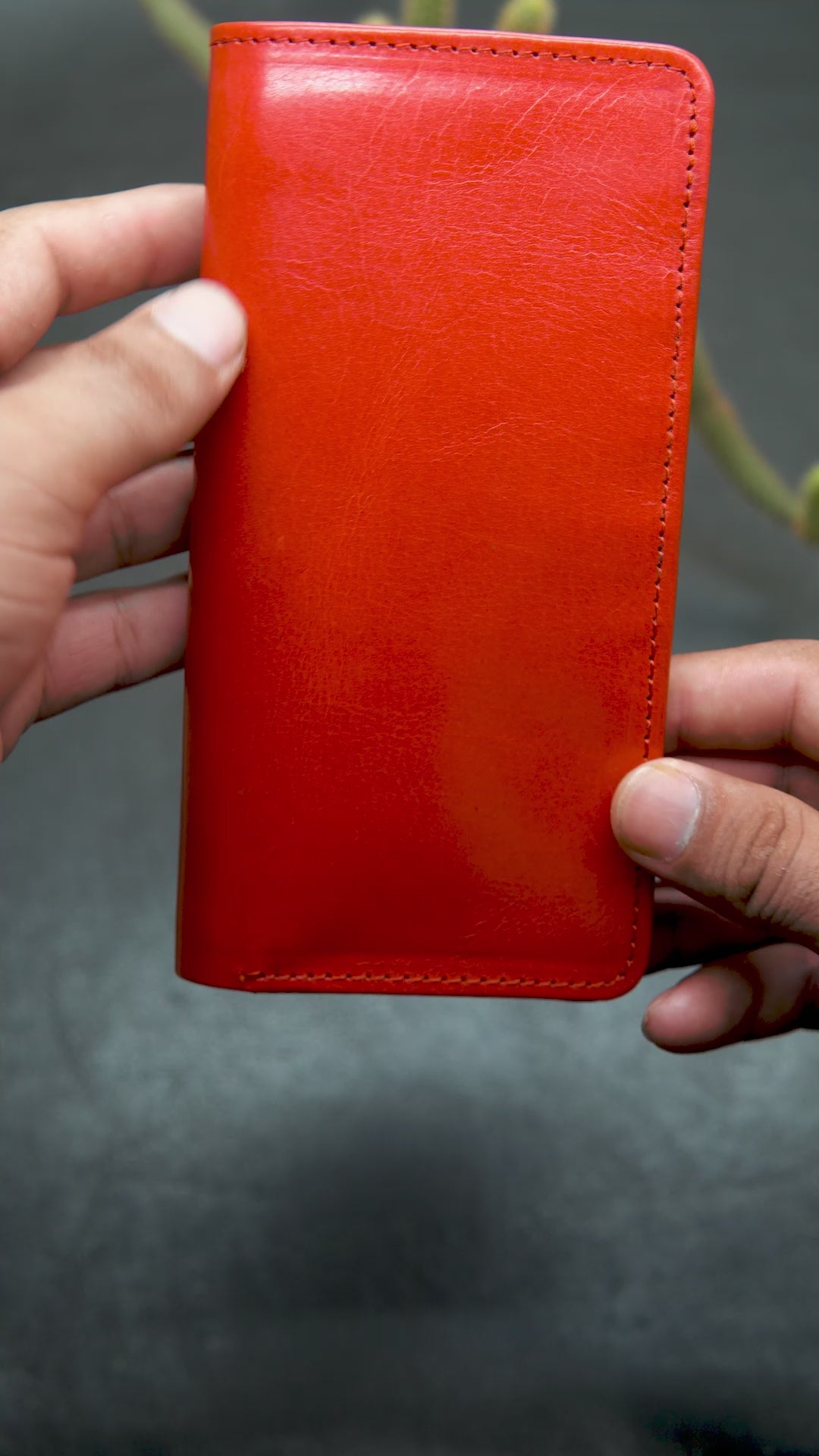 Video showing the detail view of long red leather wallet
