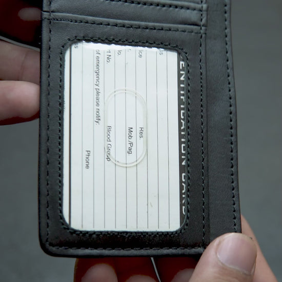 Slim black leather card holder for men with ID window, cash pocket, and 6 card slots – minimalist wallet by Bovidas
