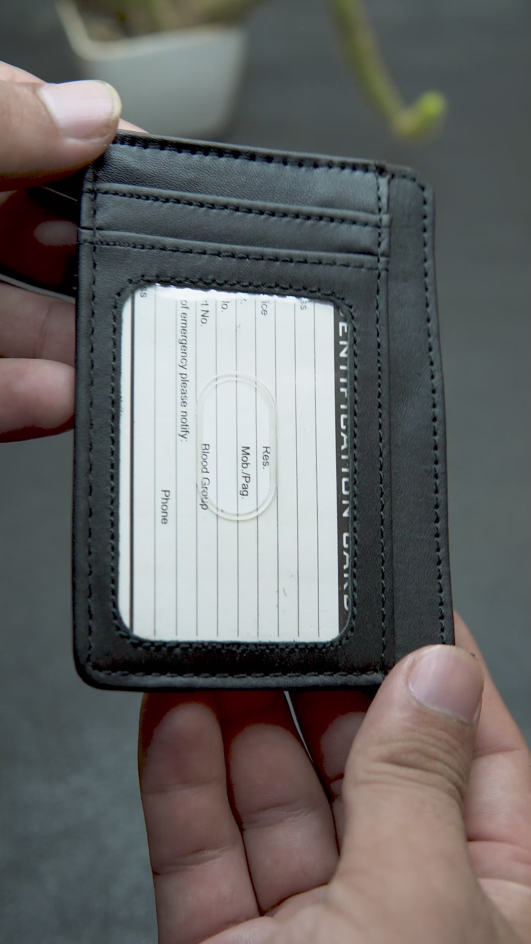 Slim black leather card holder for men with ID window, cash pocket, and 6 card slots – minimalist wallet by Bovidas
