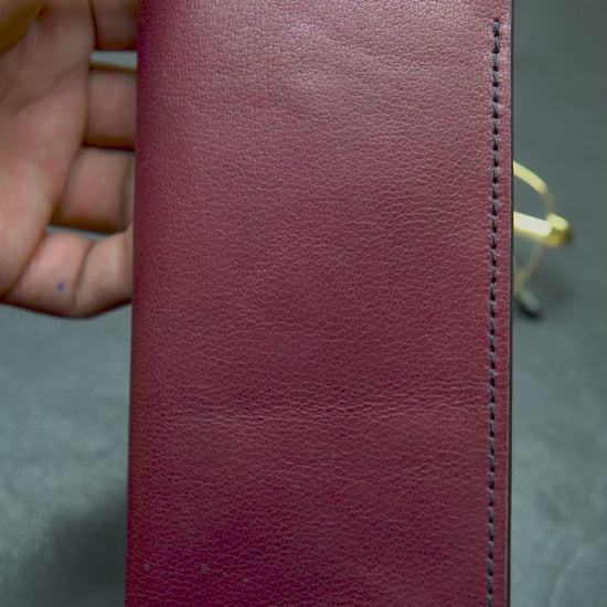 "Video showing the Bovidas Crimson Guard – red handcrafted leather glasses case with soft interior padding"