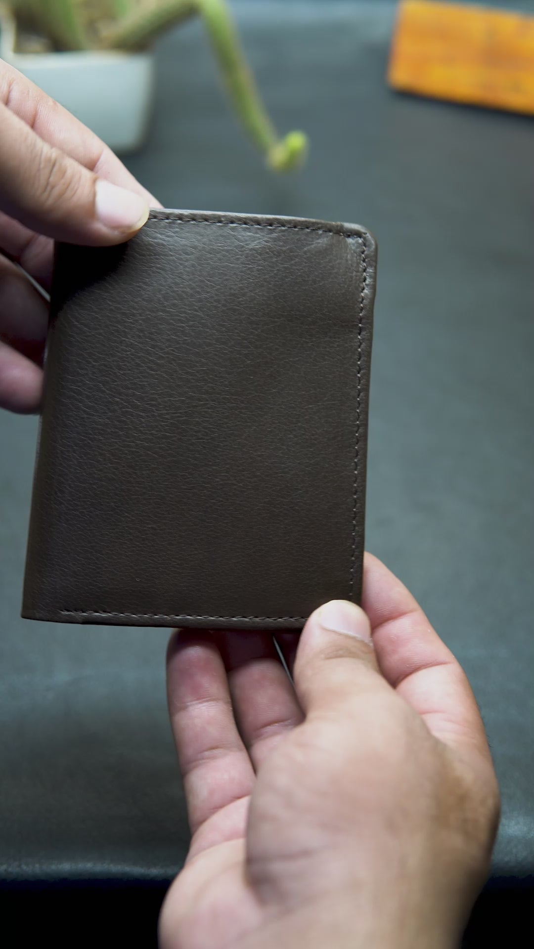 Video showing the detail view of brown leather wallet

 