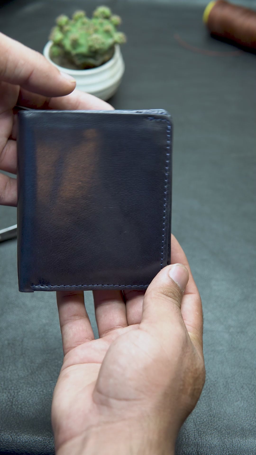  blue leather wallet with 7 card slots, button coin pocket, and two cash compartments

