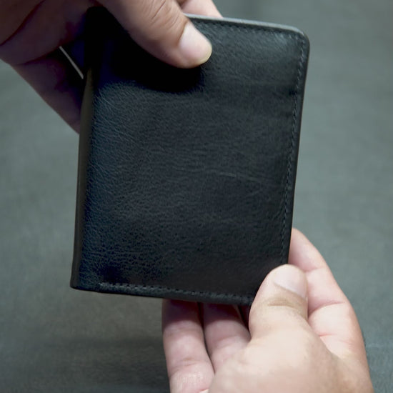"BOVIDAS Axis black leather wallet video – showing layout, card slots, coin pocket, and zip compartment"

