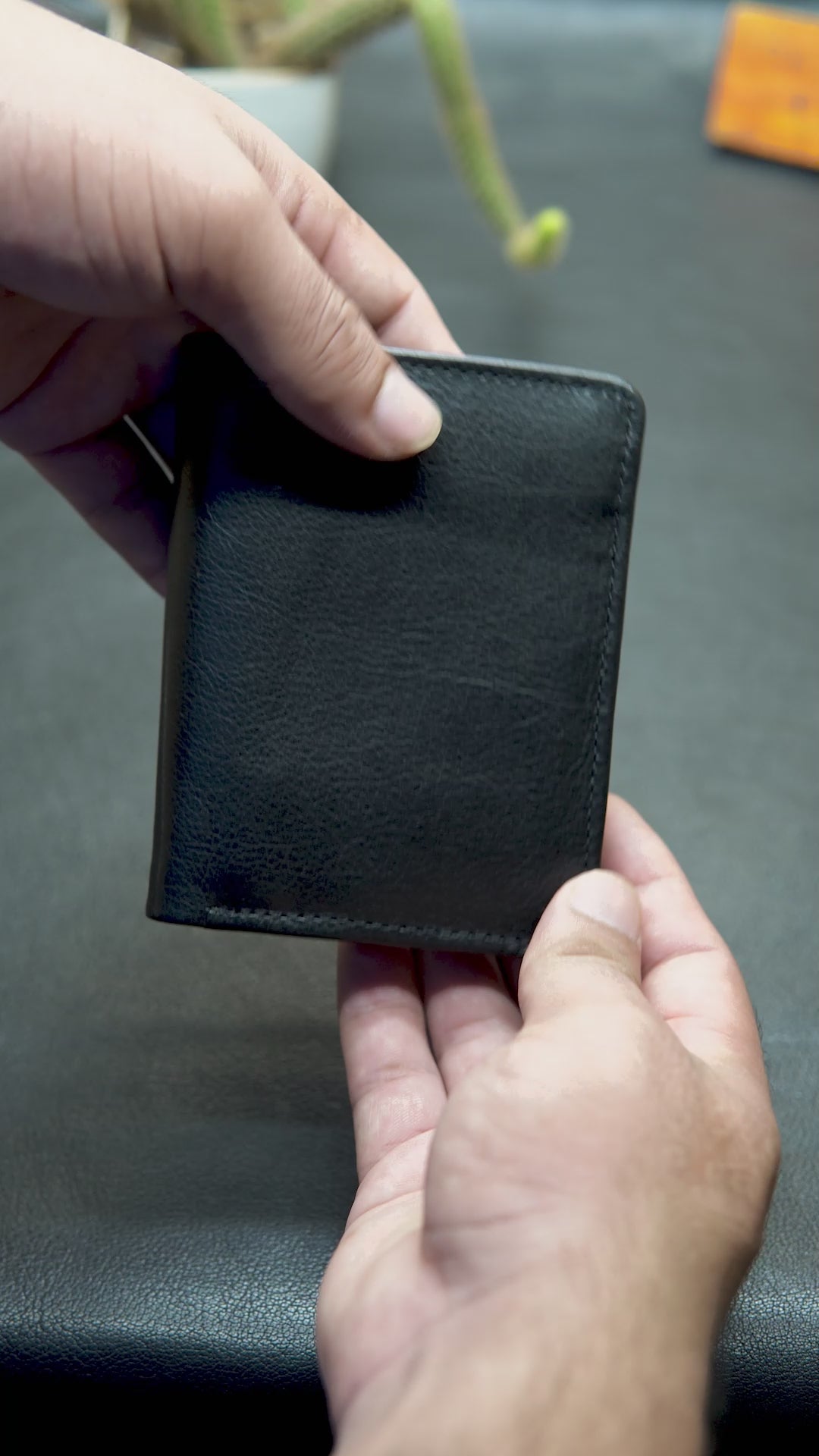 "BOVIDAS Axis black leather wallet video – showing layout, card slots, coin pocket, and zip compartment"

