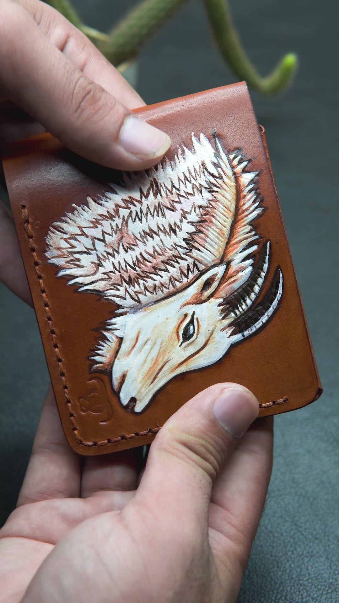 Video showing the BOVIDAS WildHorn brown leather wallet with hand-painted cow artwork, card slots, and full interior view
