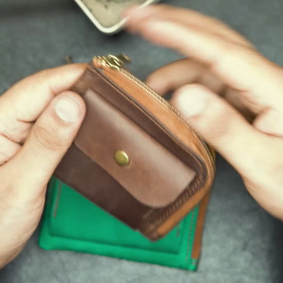 video showing the detail view of brown leather wallet