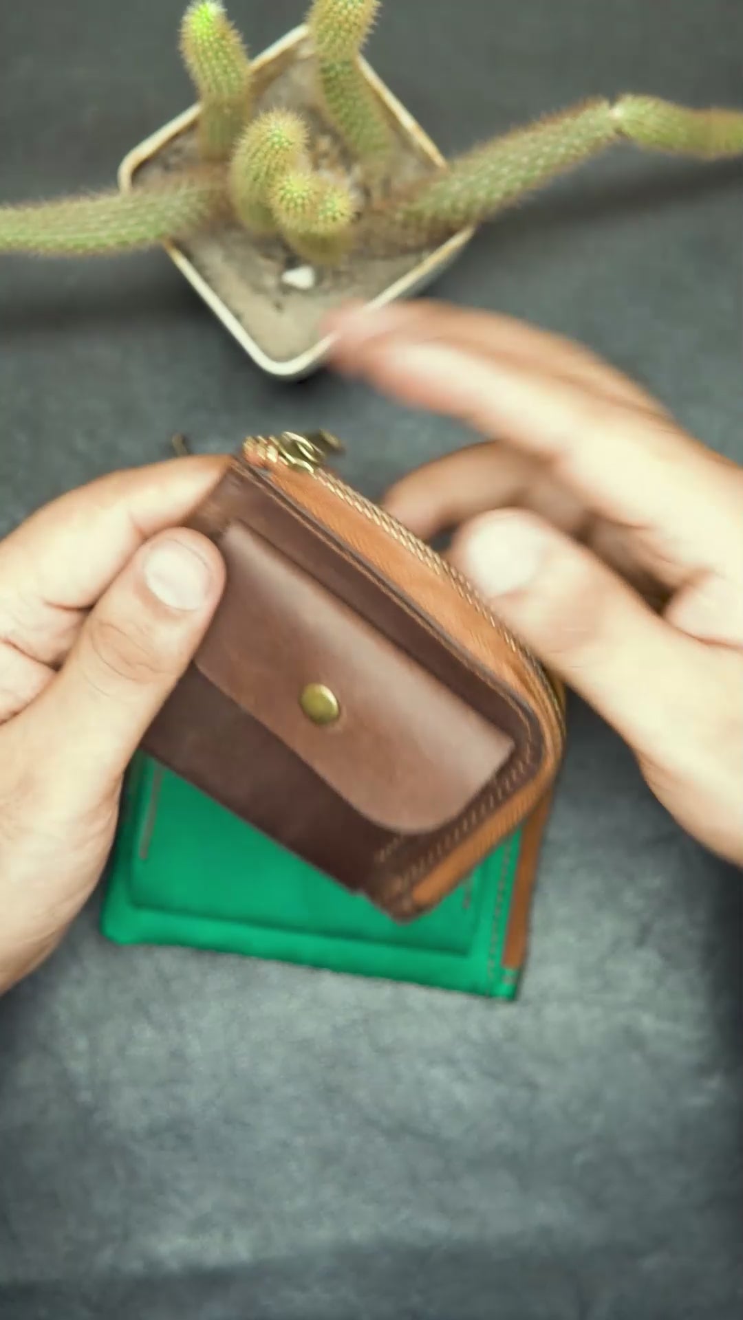 video showing the detail view of brown leather wallet