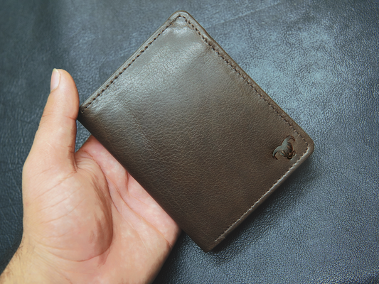  Brown leather wallet with smooth finish and minimal design