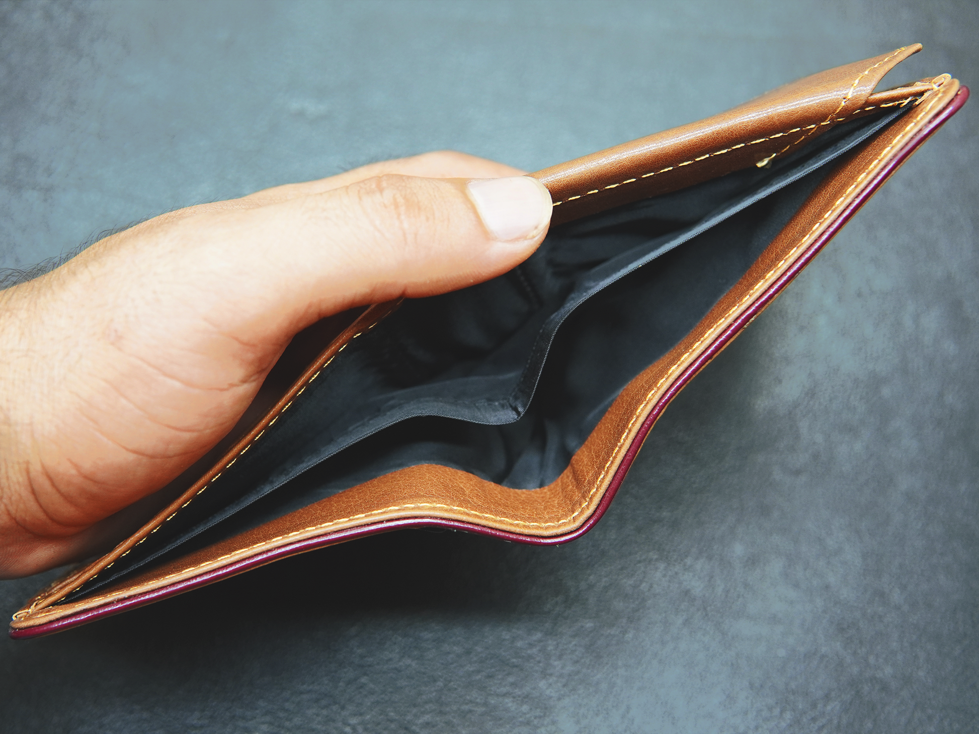 Two separate cash compartments inside Velario Classic wallet for organized storage
